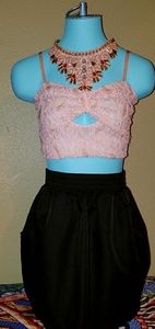 Light pink colored lace crop top.